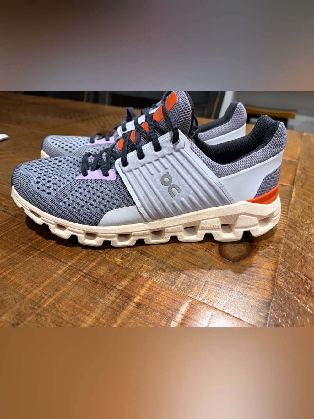 On Running women’s Sneakers in Gray with Orange and Lavender Accents size 10